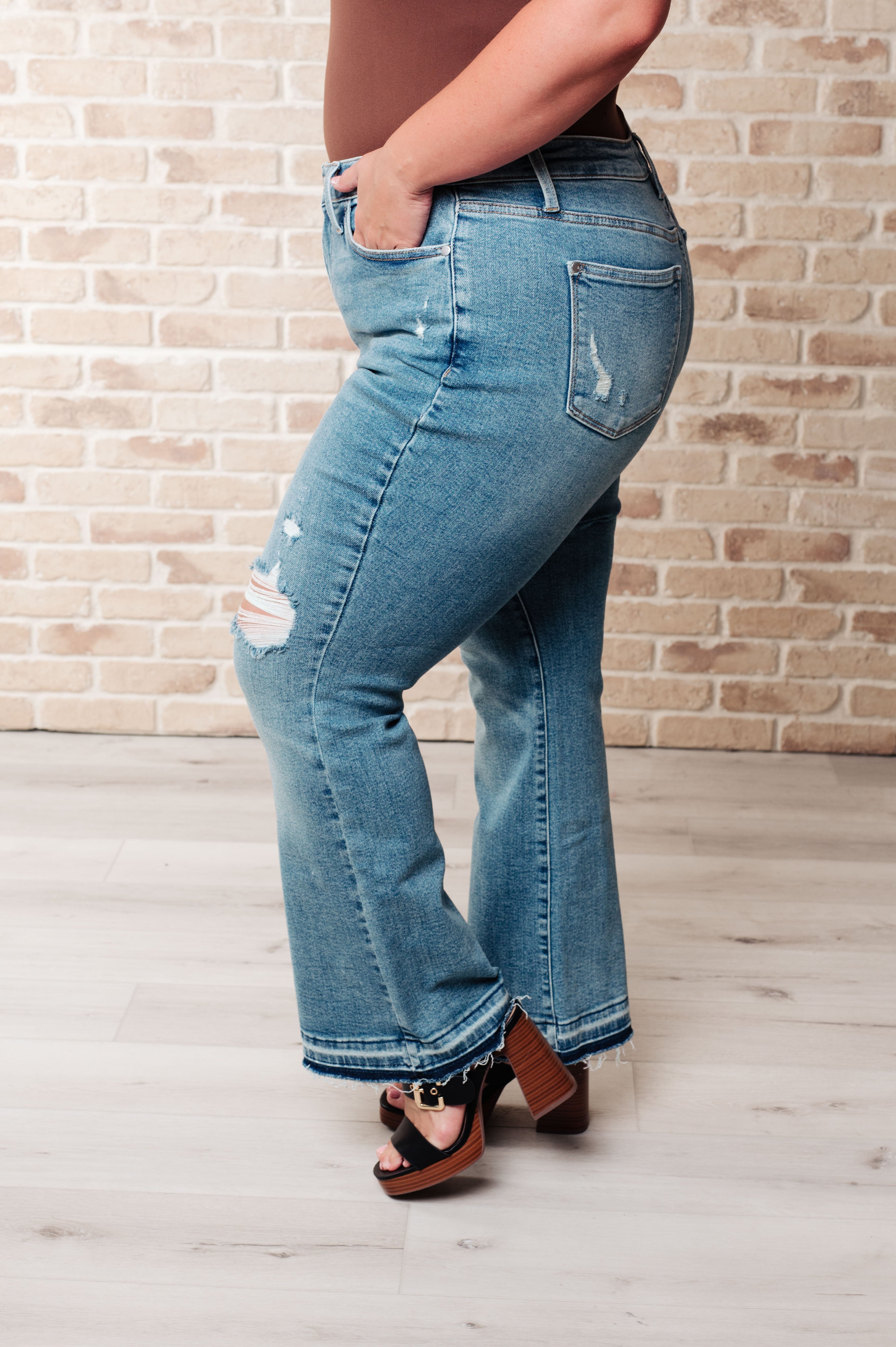 Denim Isla Mid Rise Distressed Released Hem Bootcut Jeans