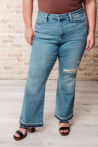 Denim Isla Mid Rise Distressed Released Hem Bootcut Jeans