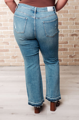 Denim Isla Mid Rise Distressed Released Hem Bootcut Jeans