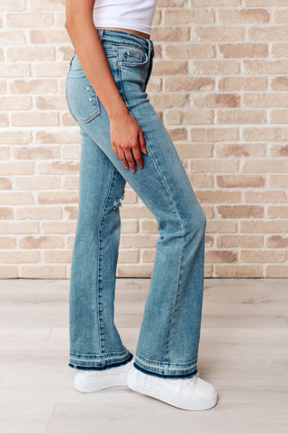 Denim Isla Mid Rise Distressed Released Hem Bootcut Jeans