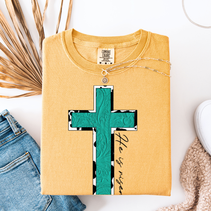 Turquoise &amp; Cow Print He is Risen Cross Graphic Tee