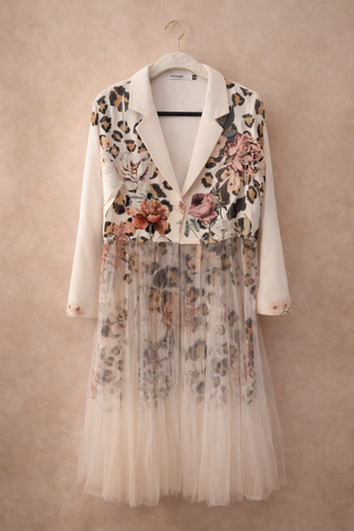 Floral and leopard print dress with sheer overlay on a beige background