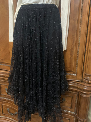 Black lace skirt with white blouse on wooden wardrobe