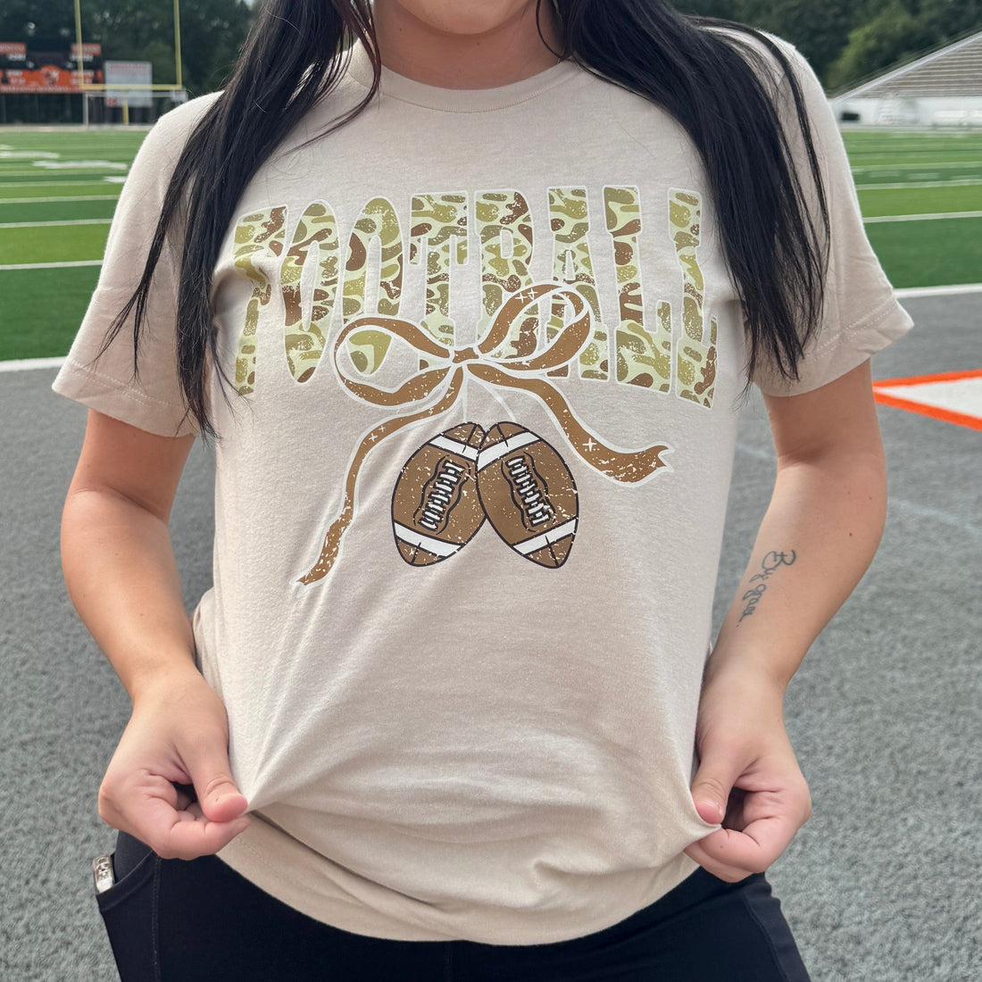 Women - Apparel - Shirts - T-Shirts Camo Football Ribbon Graphic Tee