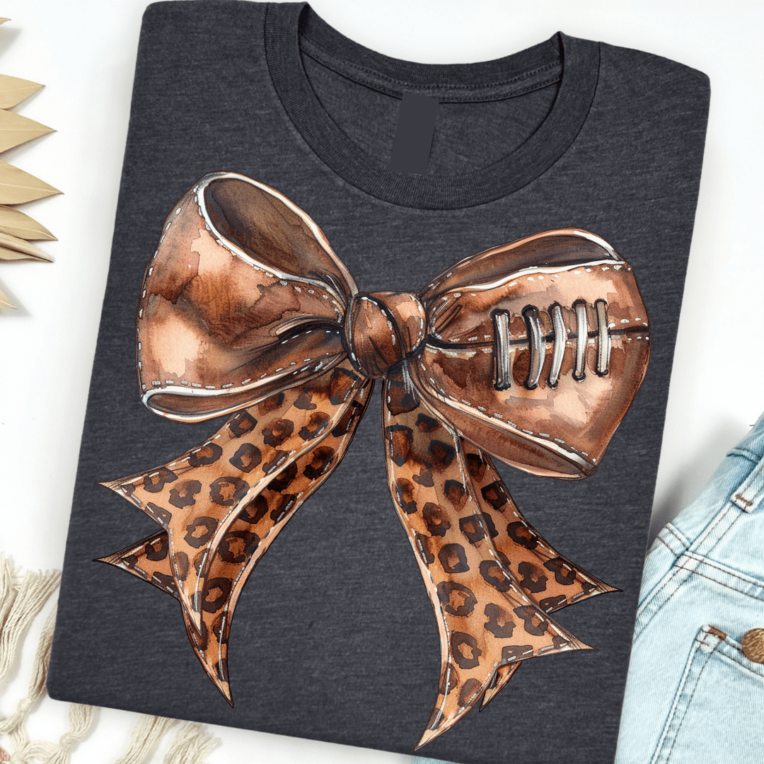 Women - Apparel - Shirts - T-Shirts Leopard Football Bow Graphic Tee